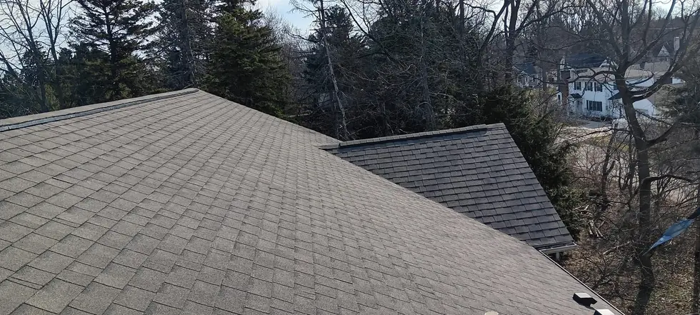 Completed architectural shingle roof with a clean ridge line, installed by TNE Roofing & Siding