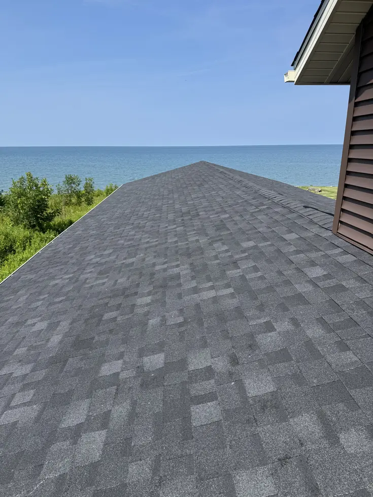 New architectural shingle roof on a lakefront Western New York home, ridge running toward the water — Hamburg, NY