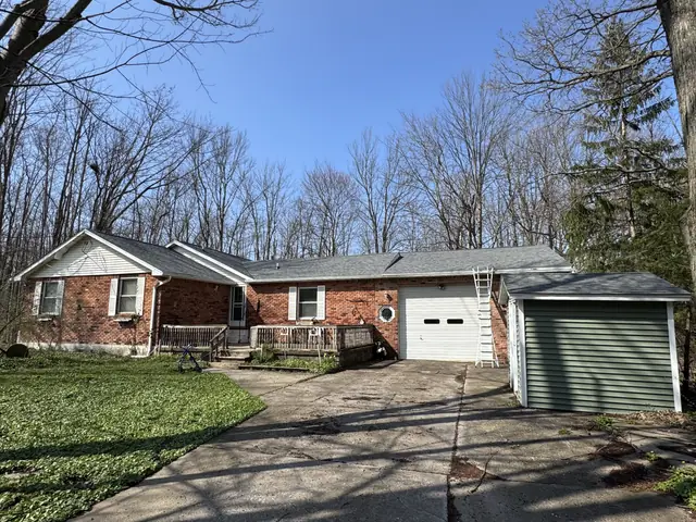 Completed roof replacement on a brick ranch home in Western New York by TNE Roofing