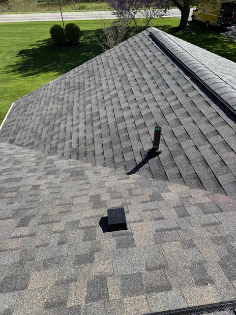 Roof vent flashed into new gray architectural shingles