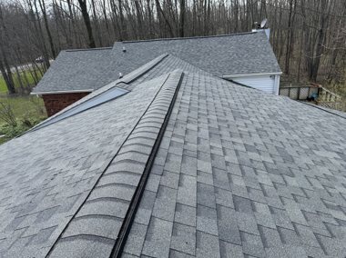 Completed roof under open sky &mdash; TNE Roofing & Siding