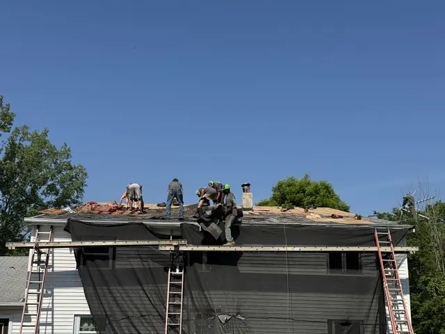 Roof tear-off at the eave edge with ladder access on a Western New York home