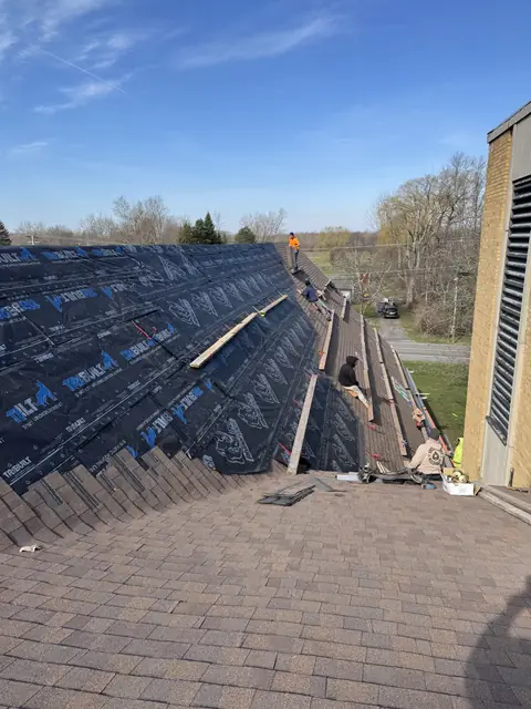 Synthetic underlayment installed across a large Western New York roof before shingling